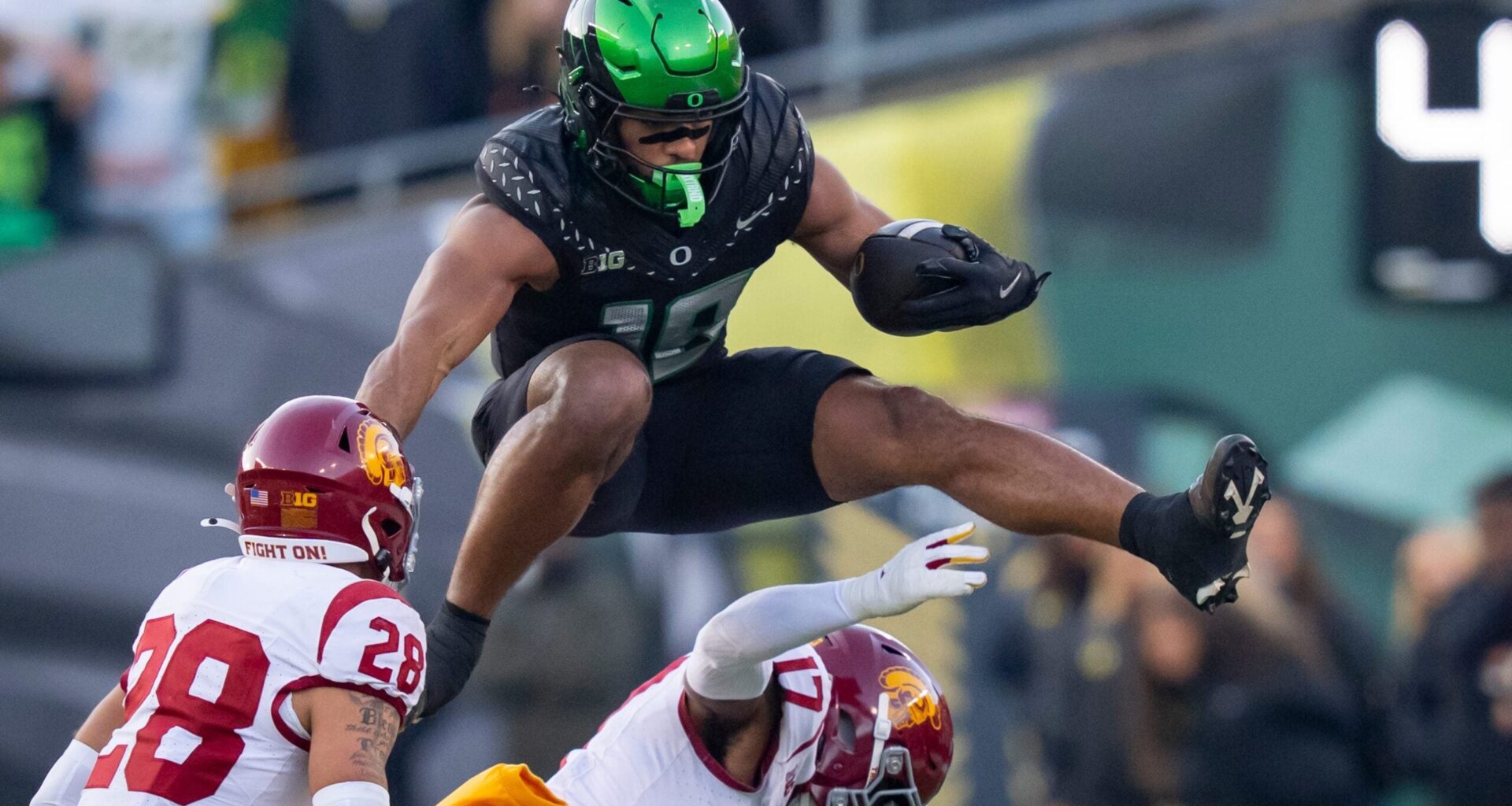Oregon tight end Kenyon Sadiq hurdles over USC cornerback DeCarlos Nicholson as the Oregon Ducks host the USC Trojans on Nov. 22, 2025, at Autzen Stadium in Eugene, Oregon.
