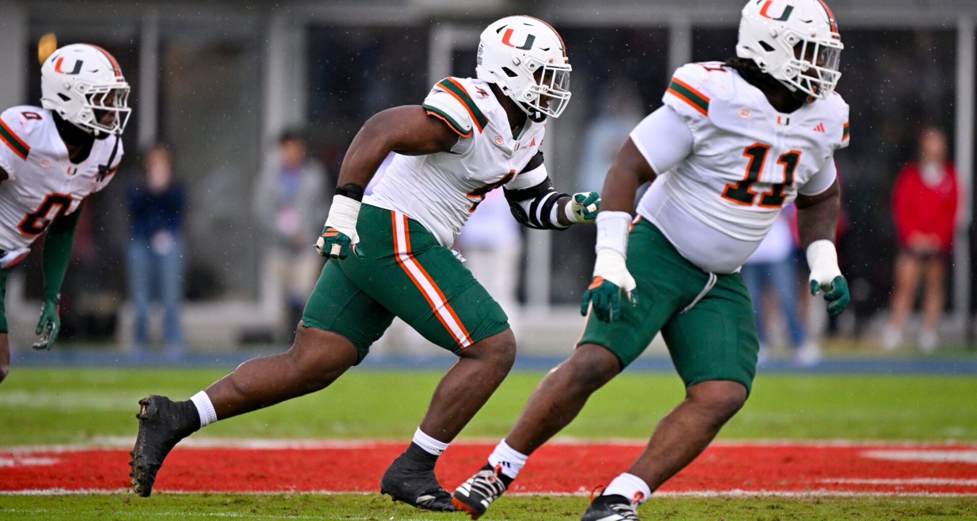 Nov 1, 2025; Dallas, Texas, USA; Miami Hurricanes defensive lineman Rueben Bain Jr. (4) and defensive lineman David Blay (11) rushes the line during the game between the Mustangs and the Hurricanes at Gerald J. Ford Stadium.
