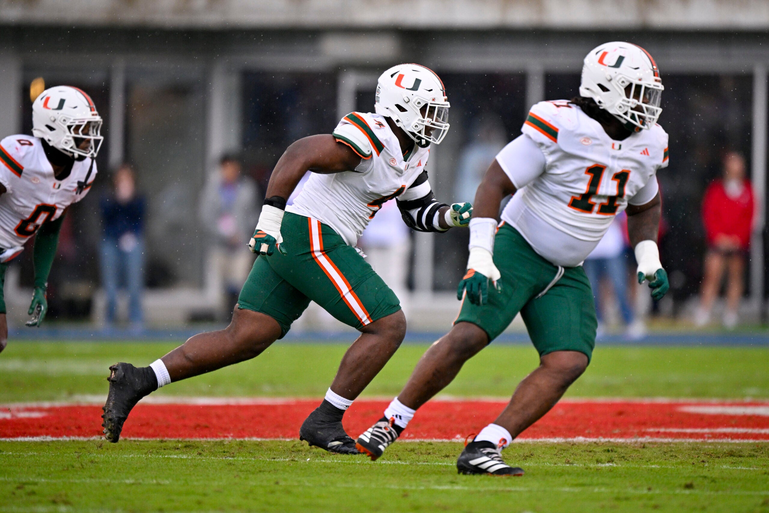 Nov 1, 2025; Dallas, Texas, USA; Miami Hurricanes defensive lineman Rueben Bain Jr. (4) and defensive lineman David Blay (11) rushes the line during the game between the Mustangs and the Hurricanes at Gerald J. Ford Stadium.