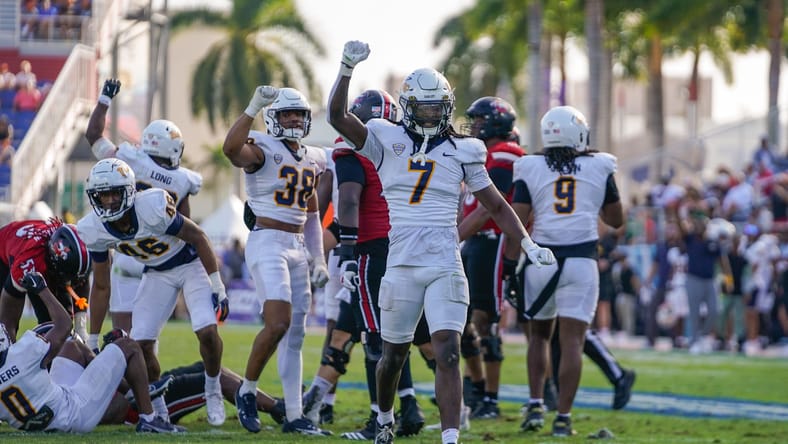 Emmanuel McNeil-Warren celebrates a defensive stop during the Boca Raton Bowl. Emmanuel McNeil-Warren vikings.