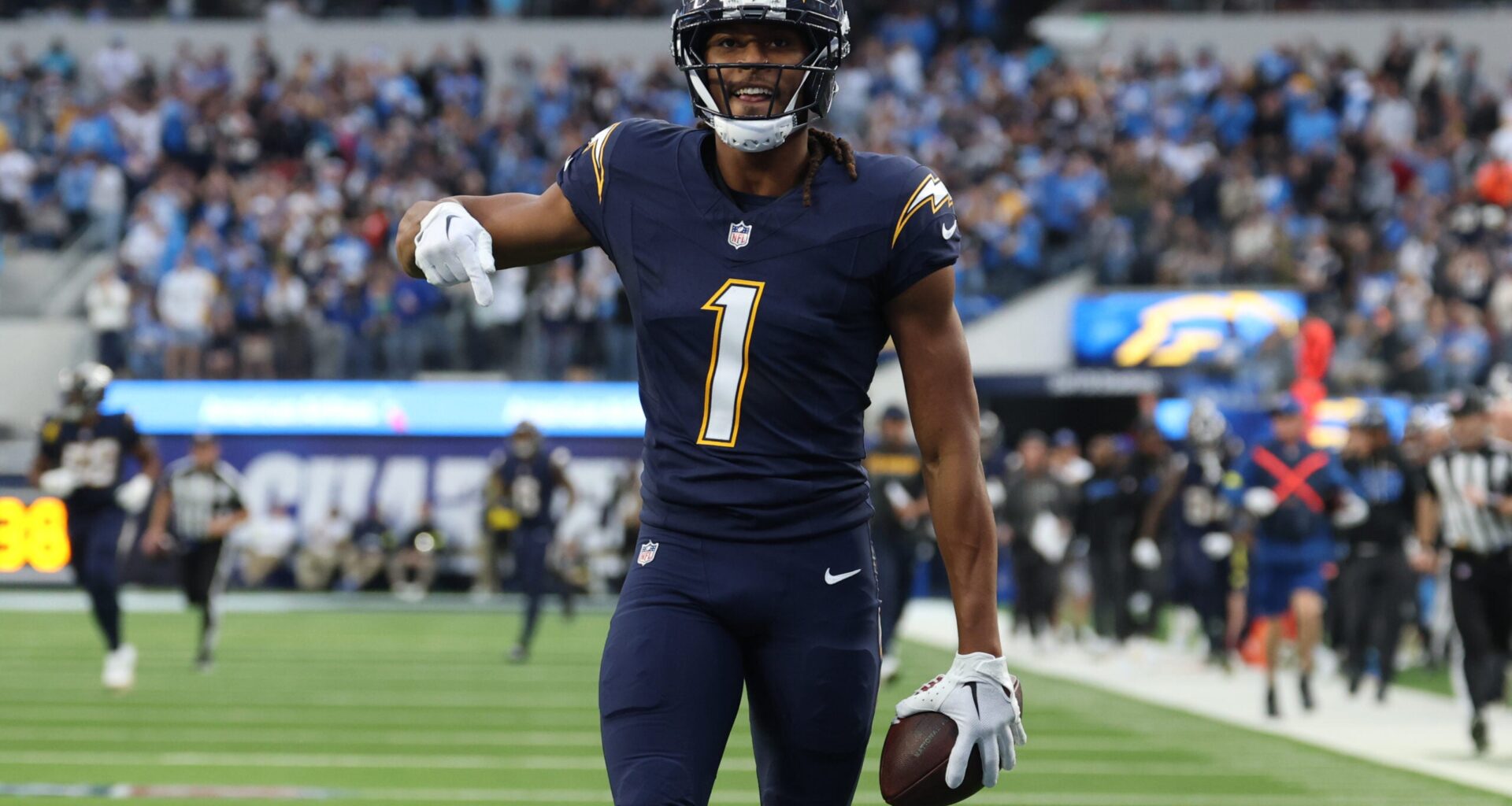 Dec 27, 2025; Inglewood, California, USA; Los Angeles Chargers wide receiver Quentin Johnston (1) reacts after making a 60-yard reception against the Houston Texans during the first half at SoFi Stadium.