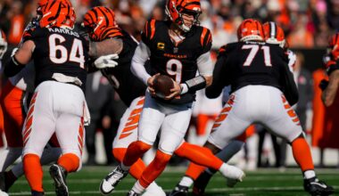 Cincinnati Bengals quarterback Joe Burrow (9) rolls out to hand off in the first quarter of the NFL Week 18 game between the Cincinnati Bengals and the Cleveland Browns at Paycor Stadium in Downtown Cincinnati on Sunday, Jan. 4, 2026.
