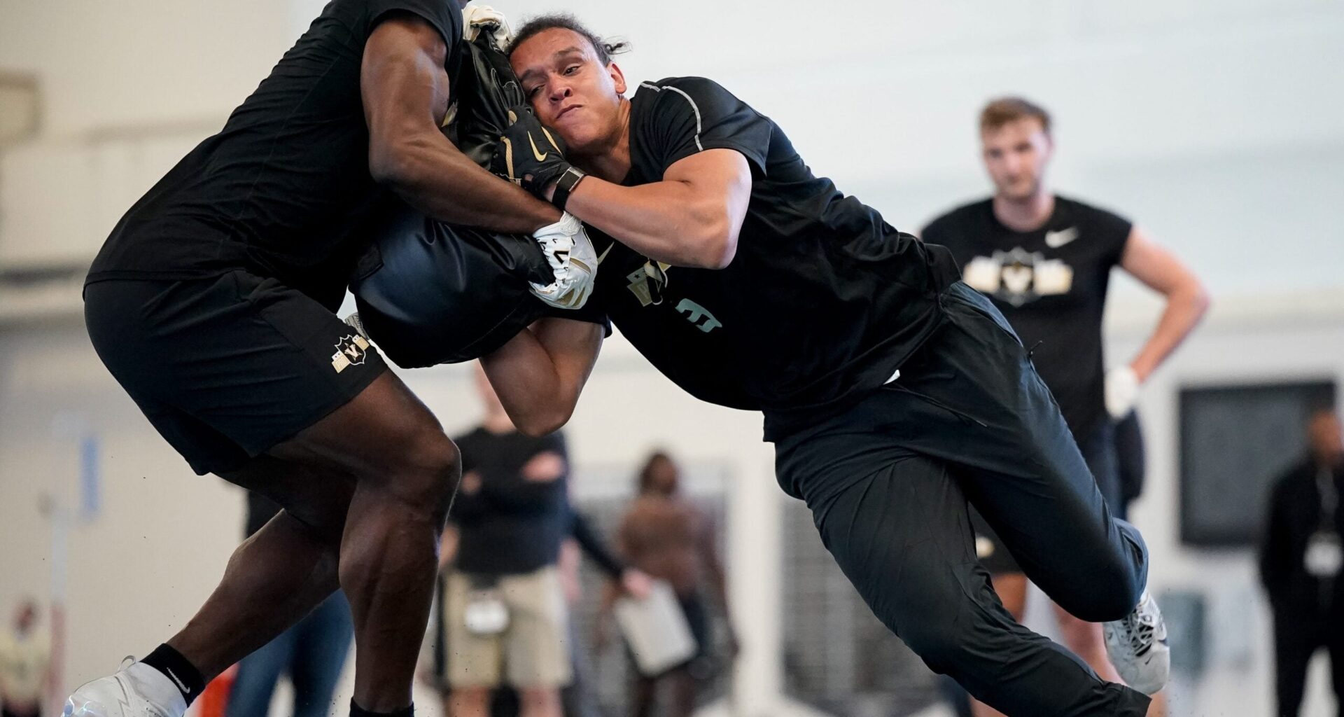 Vanderbilt tight end Emmanuel Adebi, left. and tight end Eli Stowers, right, run drills during football pro day at Vanderbilt University in Nashville, Tenn., Friday, March 20, 2026.