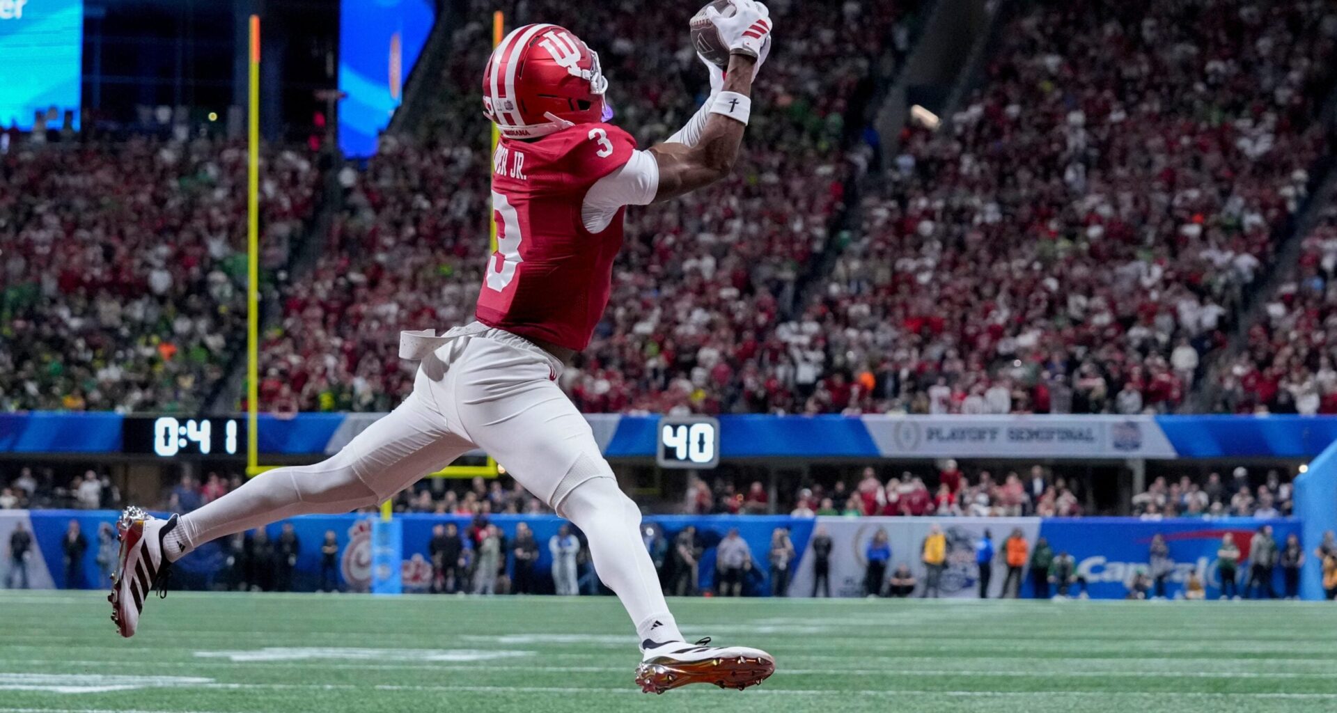 Indiana Hoosiers wide receiver Omar Cooper Jr. (3) makes a catch for a touchdown Friday, Jan. 9, 2026, during the Peach Bowl and semifinal game of the College Football Playoff against the Oregon Ducks at Mercedes-Benz Stadium in Atlanta.