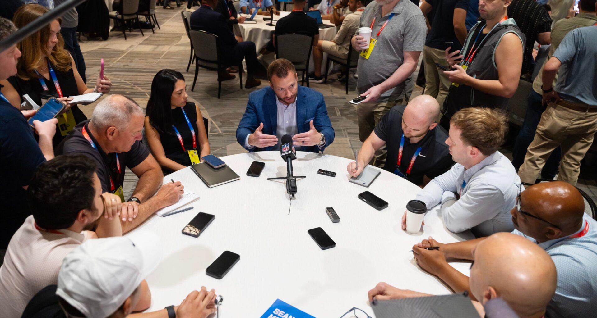Mar 30, 2026; Phoenix, AZ, USA; Los Angeles Rams head coach Sean McVay (center) speaks to reporters and the media during the 2026 NFL Annual League Meeting at the Arizona Biltmore.