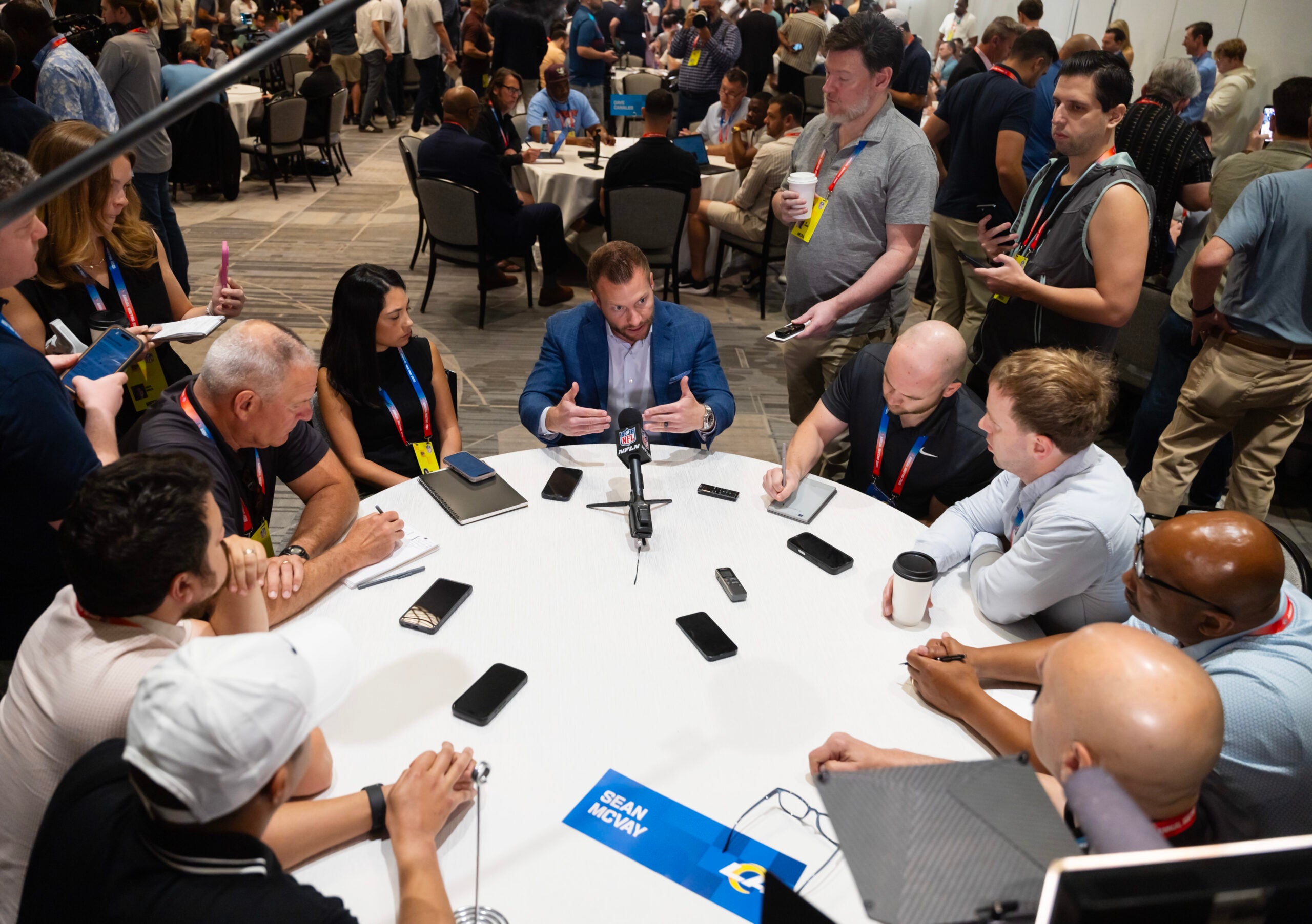 Mar 30, 2026; Phoenix, AZ, USA; Los Angeles Rams head coach Sean McVay (center) speaks to reporters and the media during the 2026 NFL Annual League Meeting at the Arizona Biltmore.