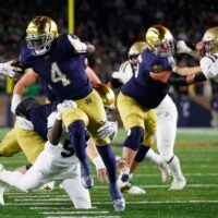 Notre Dame running back Jeremiyah Love (4) runs with the ball during the first half of a NCAA football game against Navy at Notre Dame Stadium on Saturday, Nov. 8, 2025, in South Bend.