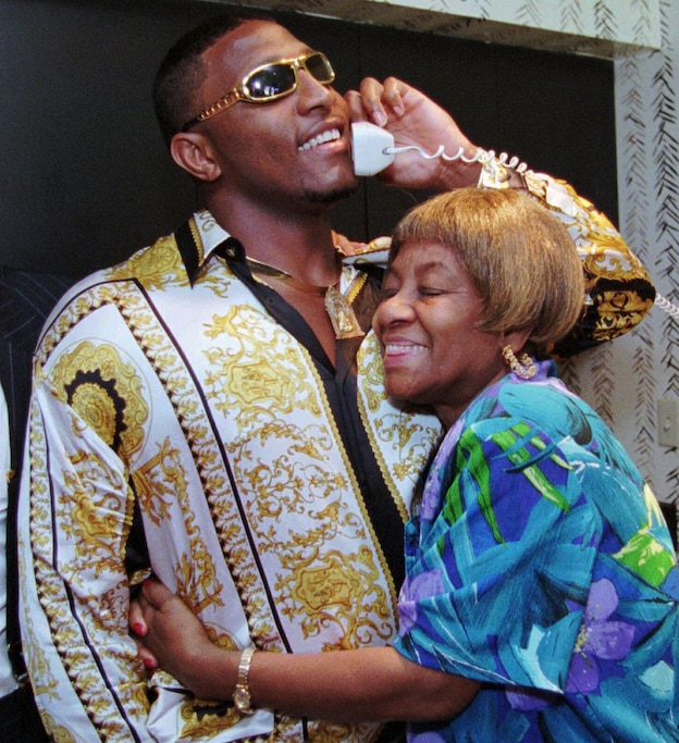 Miami's Ray Lewis is hugged by his grandmother Elease while speaking with his the Baltimore Ravens after being selected during the first round of the NFL football draft April 20, 1996, in Miami.