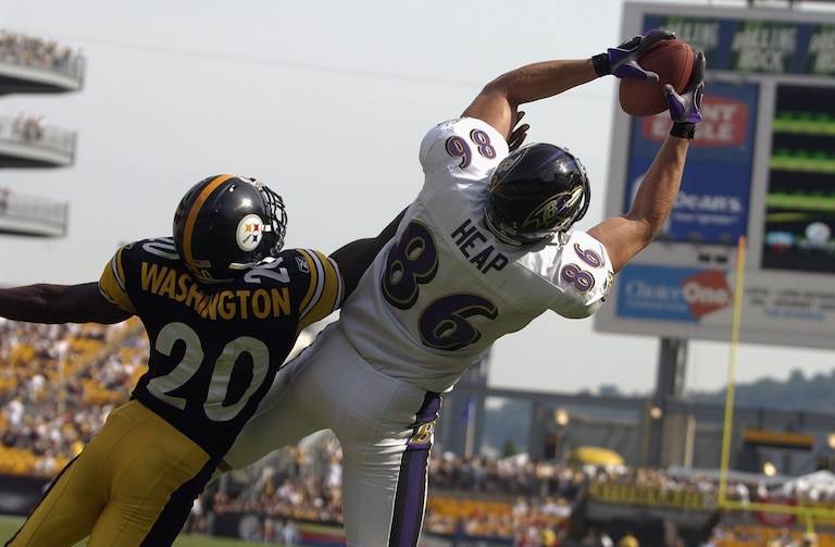 Tight end Todd Heap #86 of the Baltimore Ravens makes a catch as Dewayne Washington #20 of the Pittsburgh Steelers defends on September 7, 2003 at Heinz Field in Pittsburgh, Pennsylvania.  The Steelers defeated the Ravens 34-15.