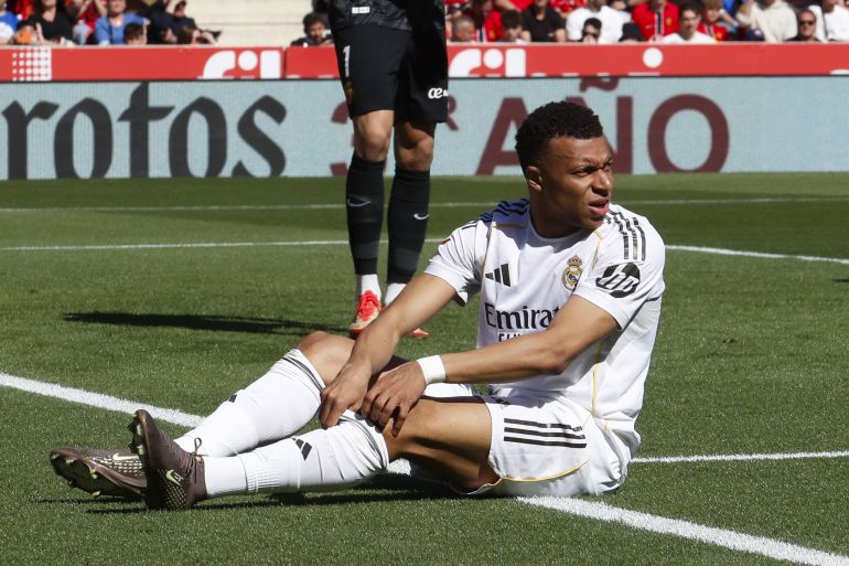 Real Madrid's French forward #10 Kylian Mbappe reacts after failing to score during the Spanish league football match between RCD Mallorca and Real Madrid CF at Mallorca Son Moix Stadium in Palma de Mallorca on April 4, 2026. (Photo by JAIME REINA / AFP)