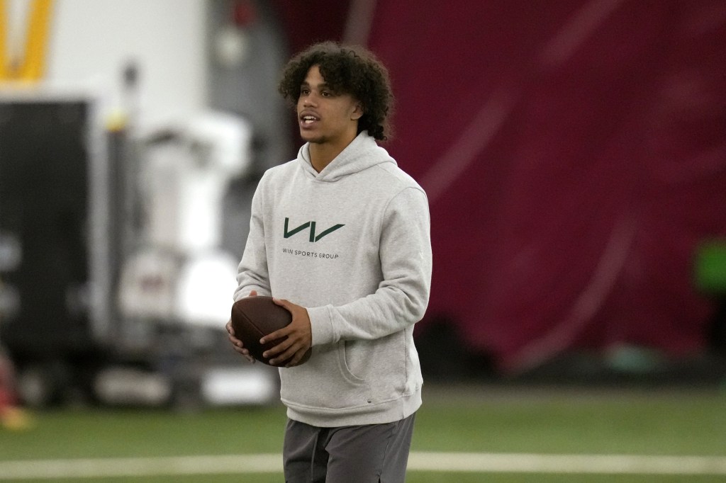 Jordyn Tyson watching teammates during Arizona State University's NFL football Pro Day.