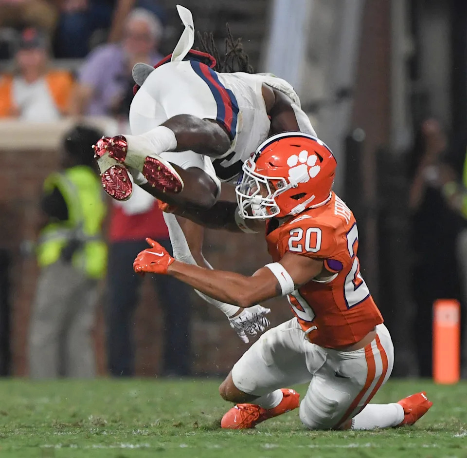 Clemson corner back Avieon Terrell (20) tackles Florida Atlantic runningback Kobe Lewis (5) during the third quarter with Florida Atlantic Sep 16, 2023; Clemson, South Carolina, USA; at Memorial Stadium.