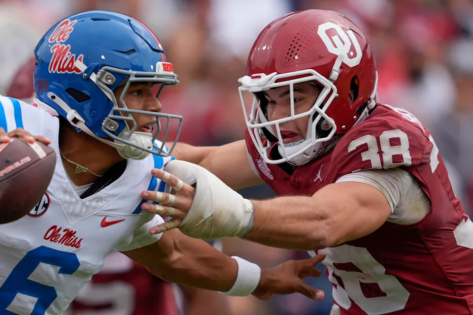 Oklahoma Sooners linebacker Owen Heinecke (38) runs after Ole Miss Rebels quarterback Trinidad Chambliss (6) during a college football game between the University of Oklahoma Sooners (OU) and the Ole Miss Rebels at Gaylord Family Ð Oklahoma Memorial Stadium in Norman, Okla., Saturday, Oct. 25, 2025. Ole Miss won 34-26.