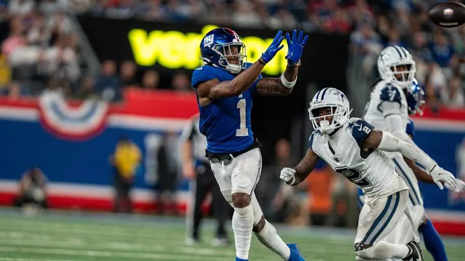 New York Giants wide receiver Malik Nabers catches a pass before being tackled by Dallas Cowboys cornerback Jourdan Lewis