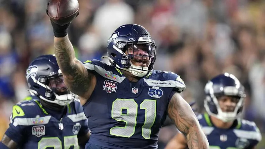 Seattle Seahawks defensive tackle Byron Murphy II (91) celebrates after recovering a fumble