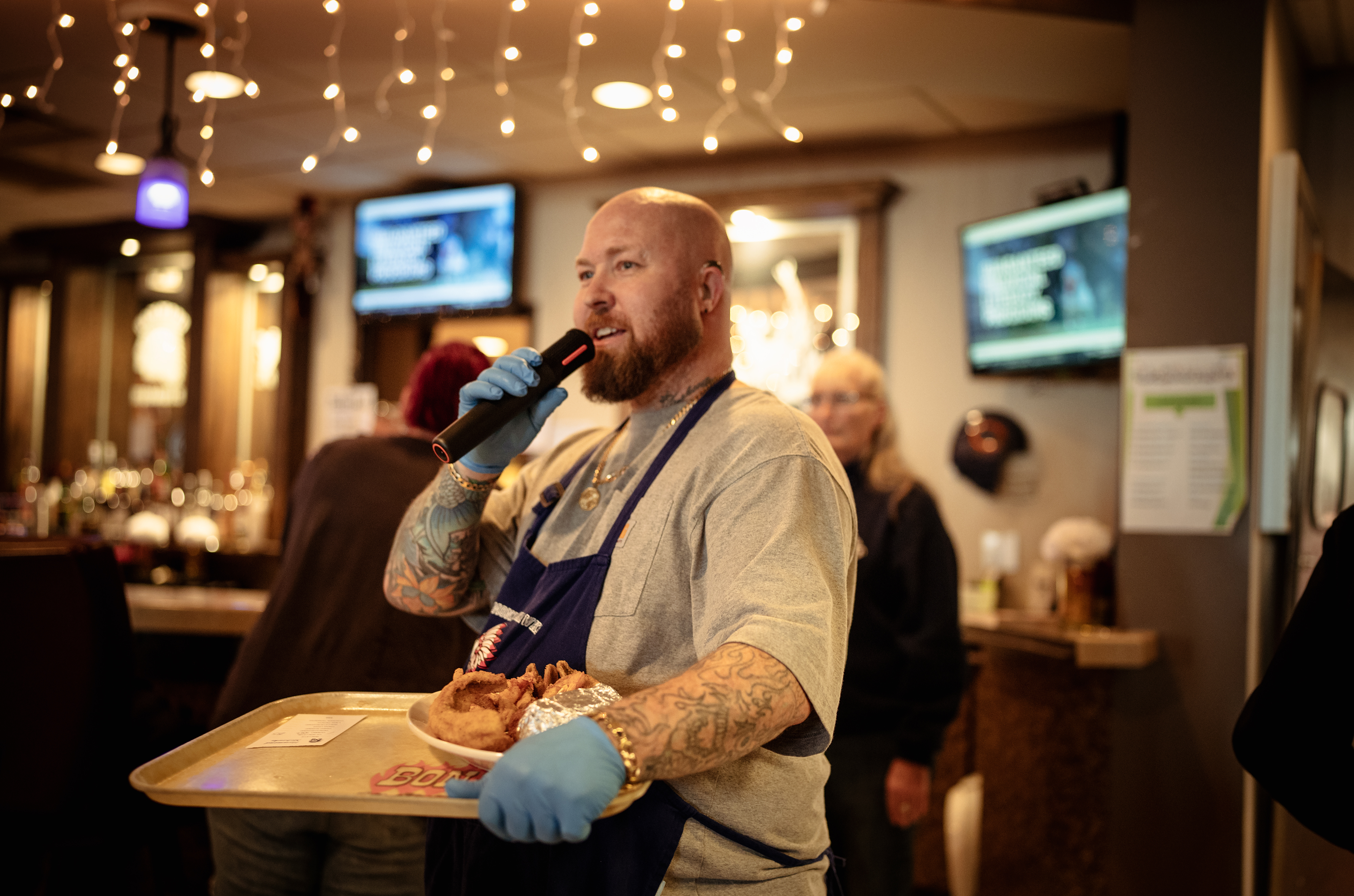 Shawn Weston calls out orders during the Lenten Friday fish...