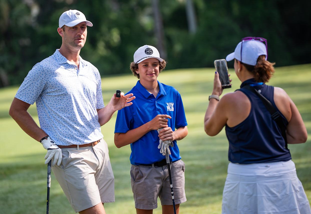 Jaguar punter Logan Cooke, left, is interviewed with Liam Smith, 14, center, while playing in the 30th annual Tom Coughlin Jay Fund Celebrity Golf Tournament Monday May 19, 2025 at TPC Sawgrass in Ponte Vedra, Fla. [Doug Engle/Florida Times-Union]