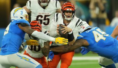 Cincinnati Bengals quarterback Joe Burrow (9) is pressured by Los Angeles Chargers safety Derwin James Jr. (3) and linebacker Tuli Tuipulotu (45) in the first half at SoFi Stadium.