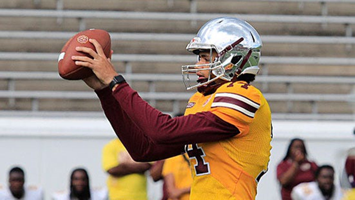 Bethune-Cookman quarterback Dominiq Ponder takes a snap during a spring game at Daytona Stadium