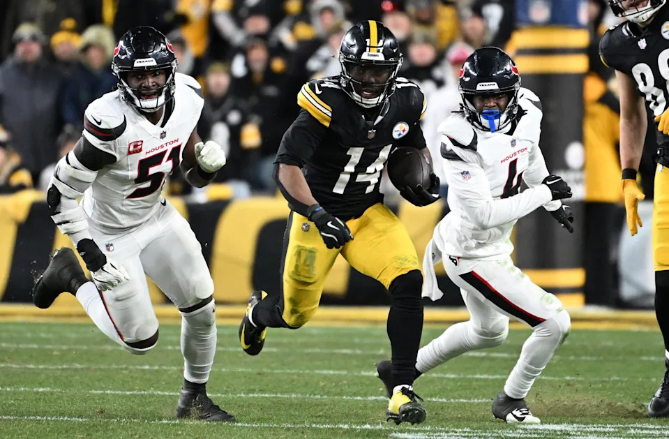 Pittsburgh Steelers running back Kenneth Gainwell (14) runs against Houston Texans defensive end Will Anderson Jr. (51) and cornerback Kamari Lassiter (4) during the second half of an AFC Wild Card Round. Barry Reeger-Imagn Images