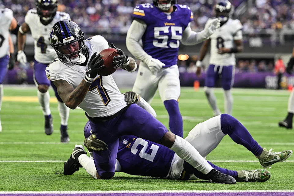 Nov 9, 2025; Minneapolis, Minnesota, USA; Baltimore Ravens wide receiver Rashod Bateman (7) is tackled by Minnesota Vikings cornerback Isaiah Rodgers (2) during the fourth quarter at U.S. Bank Stadium. Mandatory Credit: Jeffrey Becker-Imagn Images