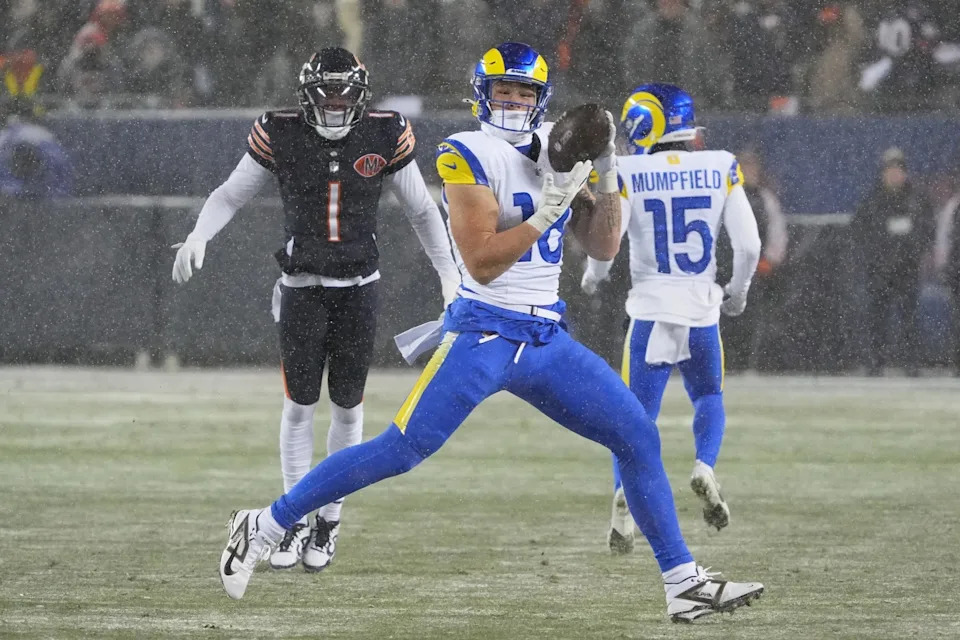 Jan 18, 2026; Chicago, IL, USA; Los Angeles Rams tight end Terrance Ferguson (18) catches a pass against Chicago Bears cornerback Jaylon Johnson (1) during the second quarter of an NFC Divisional Round game at Soldier Field. Mandatory Credit: David Banks-Imagn Images