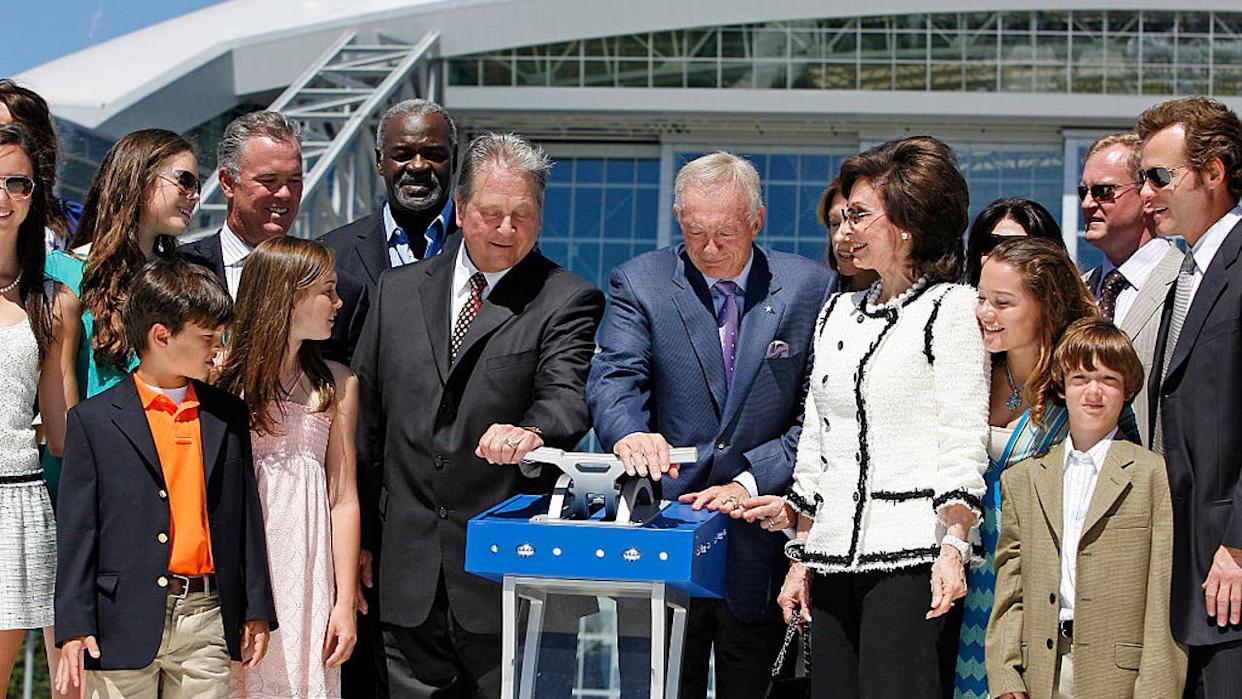 <div>27 May 2009 - Arlington mayor Robert Cluck (left) and owner Jerry Jones of the Dallas Cowboys move a lever to open the stadium doors during the Cowboys Stadium ribbon cutting event in Arlington, Texas. (Photo by James D. Smith/Icon SMI/Corbis/Icon Sportswire via Getty Images)</div>