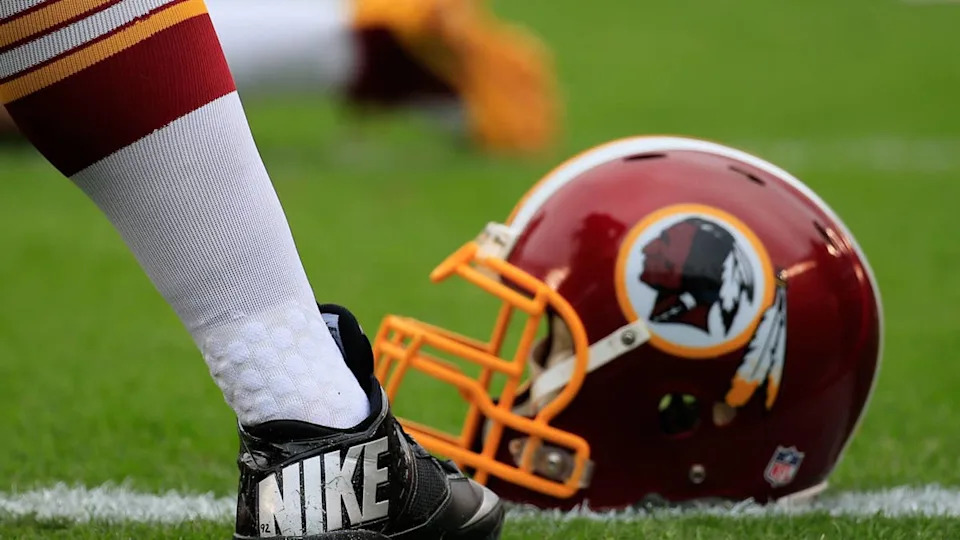 PHILADELPHIA, PA - SEPTEMBER 21: A Washington Redskins Nike cleat and helmet is seen on the field before the game against the Philadelphia Eagles at Lincoln Financial Field on September 21, 2014 in Philadelphia, Pennsylvania. (Photo by Rob Carr/Getty Images)
