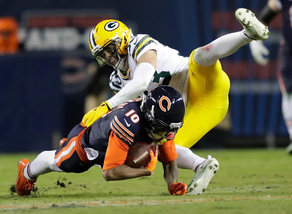 Chicago Bears wide receiver Luther Burden III (10) dives for a first down on a 27-yard reception against Green Bay Packers safety Evan Williams (33) in the second quarter during their wild-card playoff football game Saturday, January 10, 2026, at Soldier Field in Chicago, Illinois.&nbsp;© Dan Powers/USA TODAY NETWORK-Wisconsin / USA TODAY NETWORK via Imagn Images.