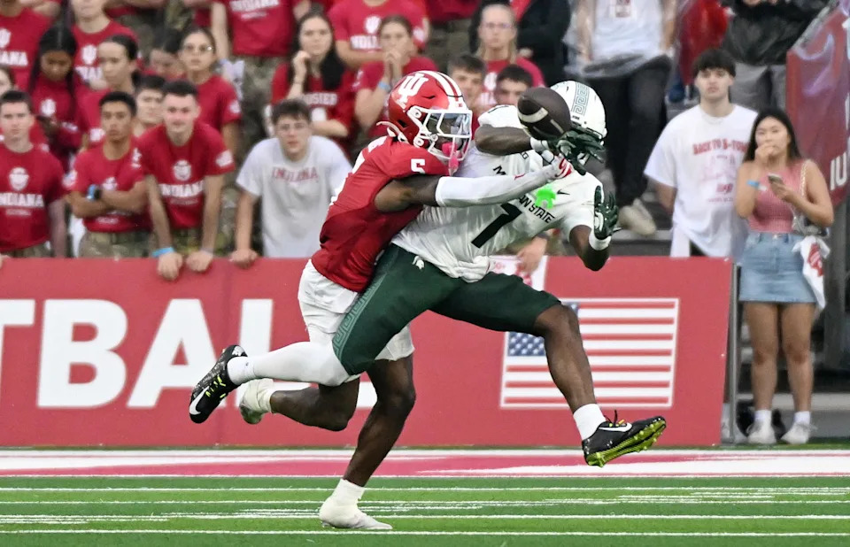 Oct 18, 2025; Bloomington, Indiana, USA; Indiana Hoosiers defensive back D'Angelo Ponds (5) breaks up a pass intended for Michigan State Spartans wide receiver Omari Kelly (1) during the second half at Memorial Stadium. Mandatory Credit: Robert Goddin-Imagn Images.