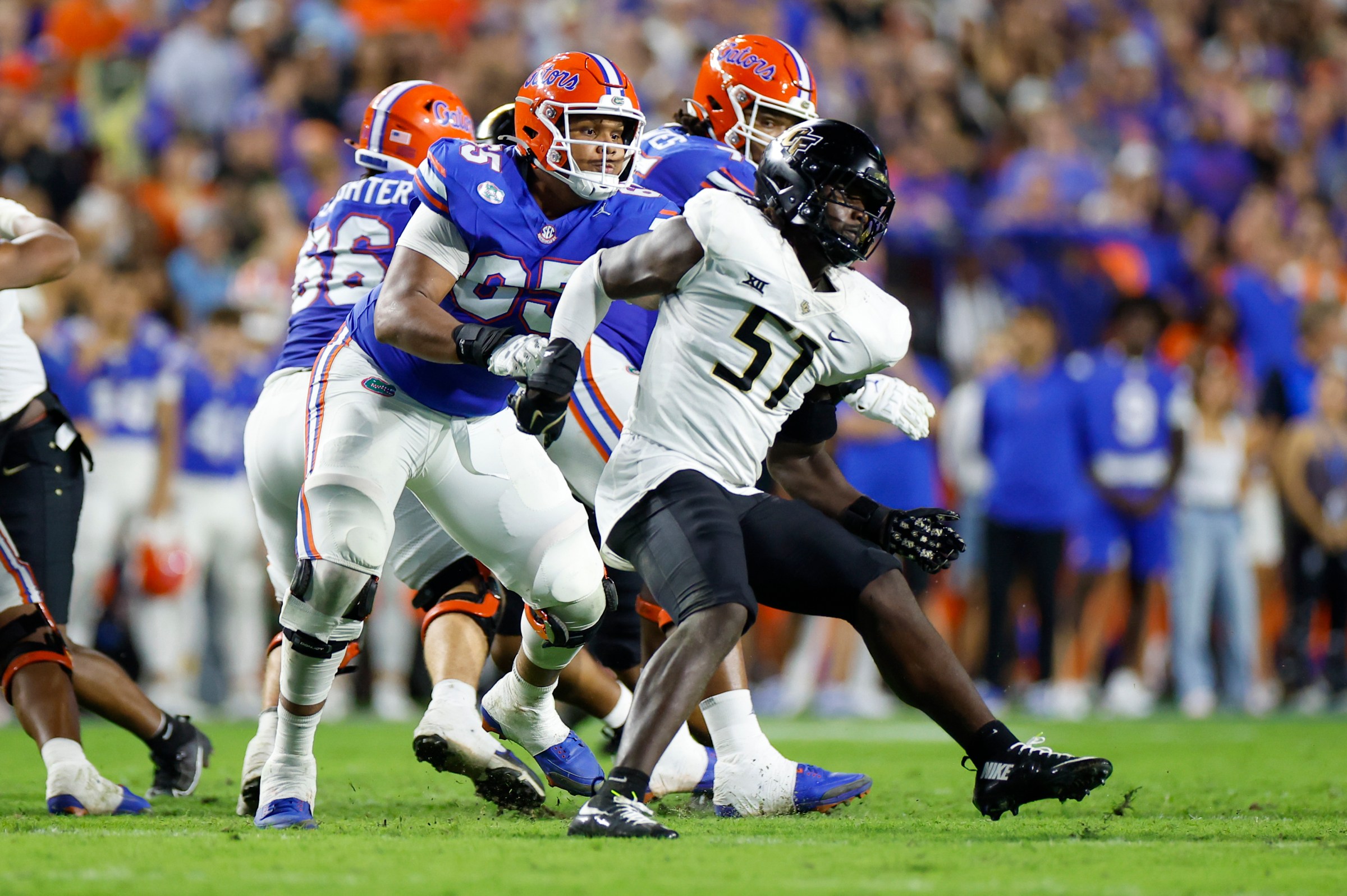 GAINESVILLE, FL - OCTOBER 05: UCF Knights defensive end Malachi Lawrence (51) battles Florida Gators offensive lineman Brandon Crenshaw-Dickson (65) during the game between the Florida Gators and the UCF Knights on October 5, 2024 at Ben Hill Griffin Stadium at Florida Field in Gainesville, Fl. (Photo by David Rosenblum/Icon Sportswire via Getty Images)