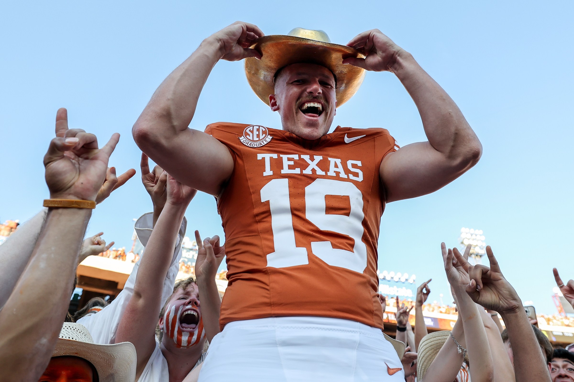DALLAS, TEXAS - OCTOBER 11: Jack Bouwmeester #19 of the Texas Longhorns celebrates with the Golden Hat after defeating the Oklahoma Sooners at Cotton Bowl on October 11, 2025 in Dallas, Texas. (Photo by Tim Warner/Getty Images)