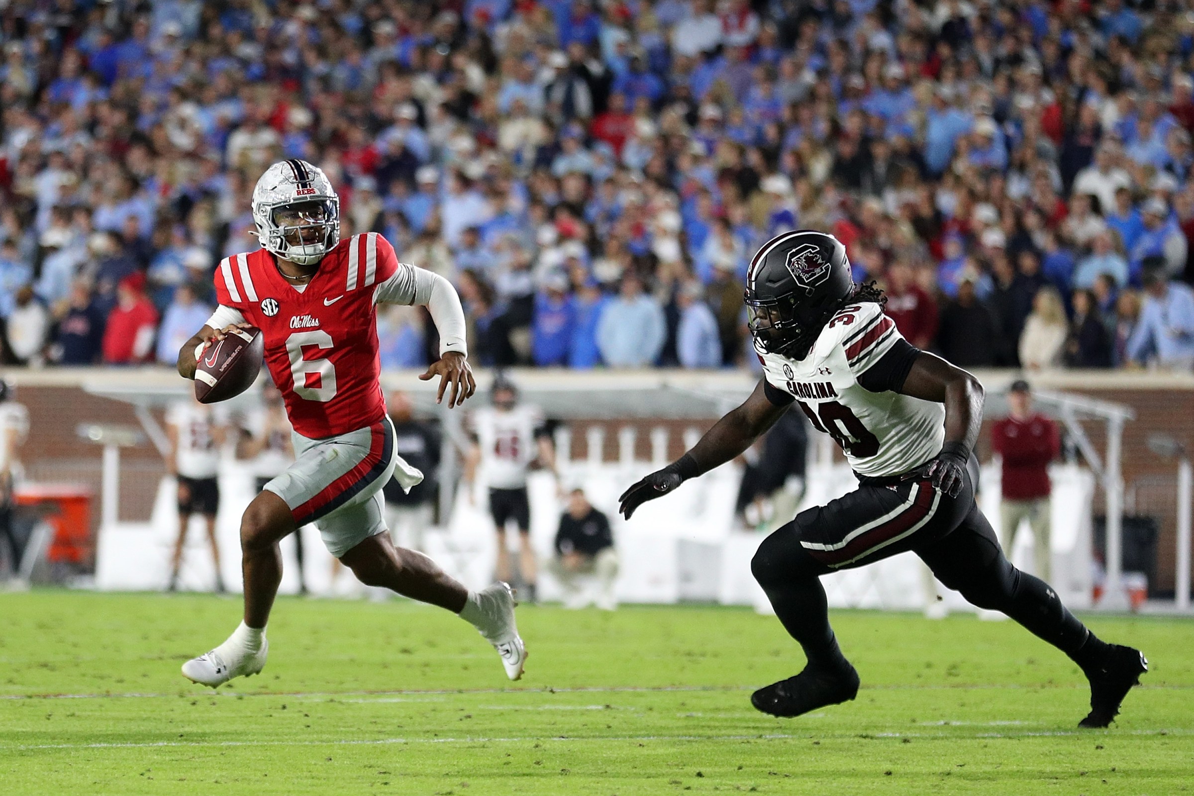 OXFORD, MISSISSIPPI - NOVEMBER 01: Trinidad Chambliss #6 of the Mississippi Rebels looks to pass against Demon Clowney #30 of the South Carolina Gamecocks during the first half at Vaught-Hemingway Stadium on November 01, 2025 in Oxford, Mississippi. (Photo by Justin Ford/Getty Images)