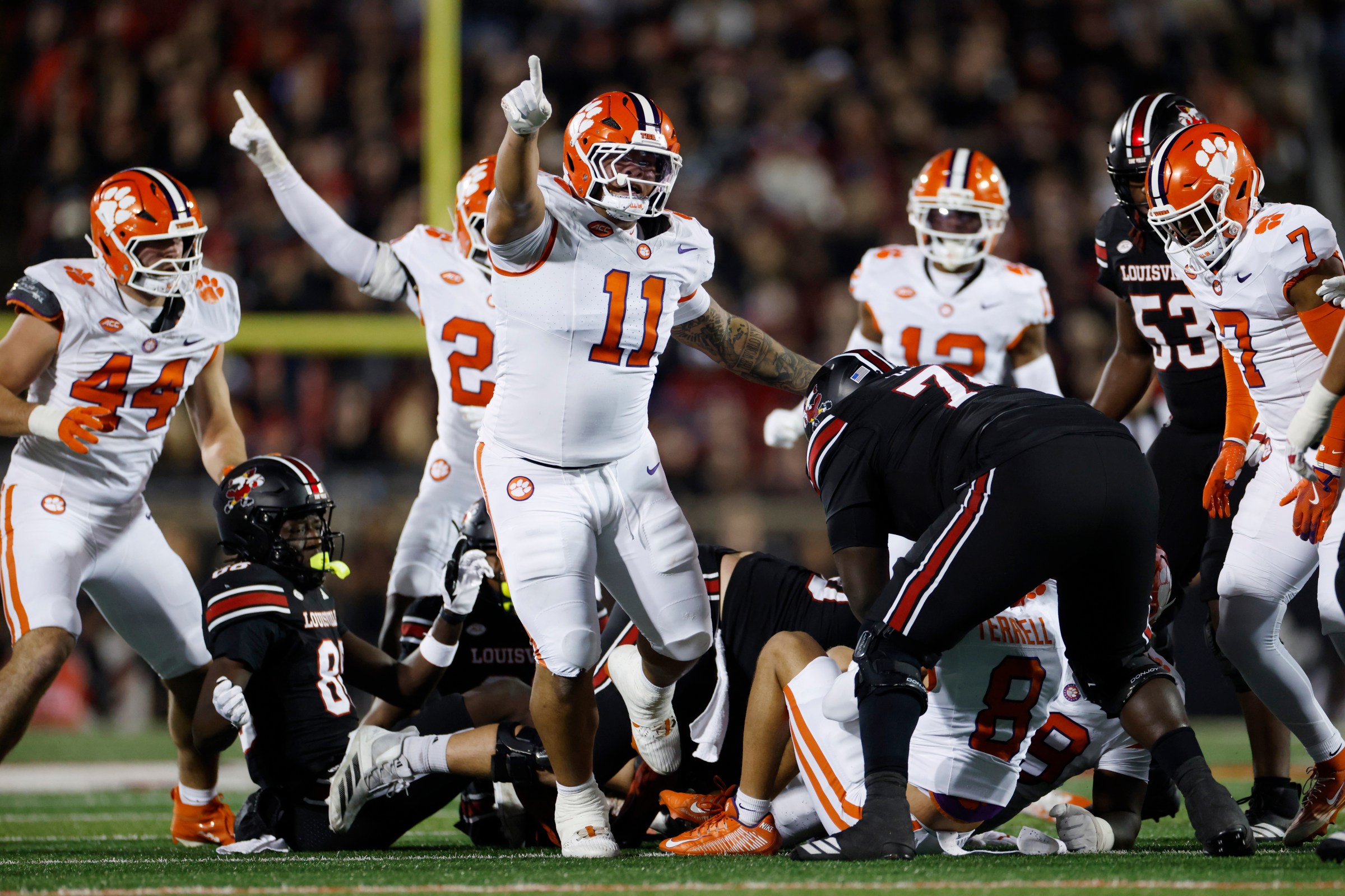 LOUISVILLE, KY - NOVEMBER 14: Peter Woods #11 of the Clemson Tigers celebrates with teammates after a turnover on defense during a college football game against the Louisville Cardinals on November 14, 2025 at L&N Federal Credit Union Stadium in Louisville, Kentucky. (Photo by Joe Robbins/Icon Sportswire via Getty Images)