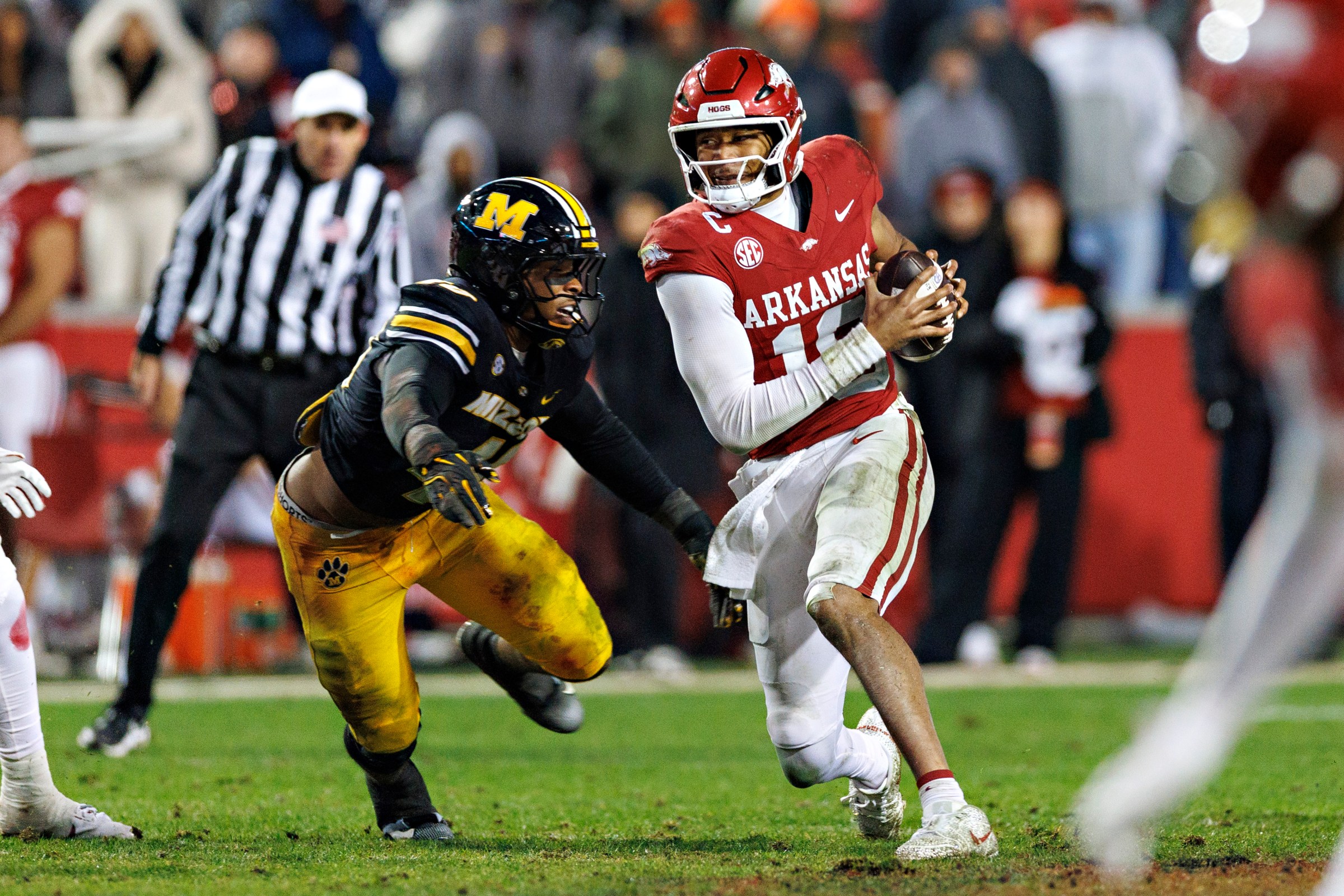 FAYETTEVILLE, ARKANSAS - NOVEMBER 29: Taylen Green #10 of the Arkansas Razorbacks is sacked in the second half by Josiah Trotter #40 of the Missouri Tigers at Donald W. Reynolds Razorback Stadium on November 29, 2025 in Fayetteville, Arkansas. The Tigers defeated the Razorbacks 31-17. (Photo by Wesley Hitt/Getty Images)