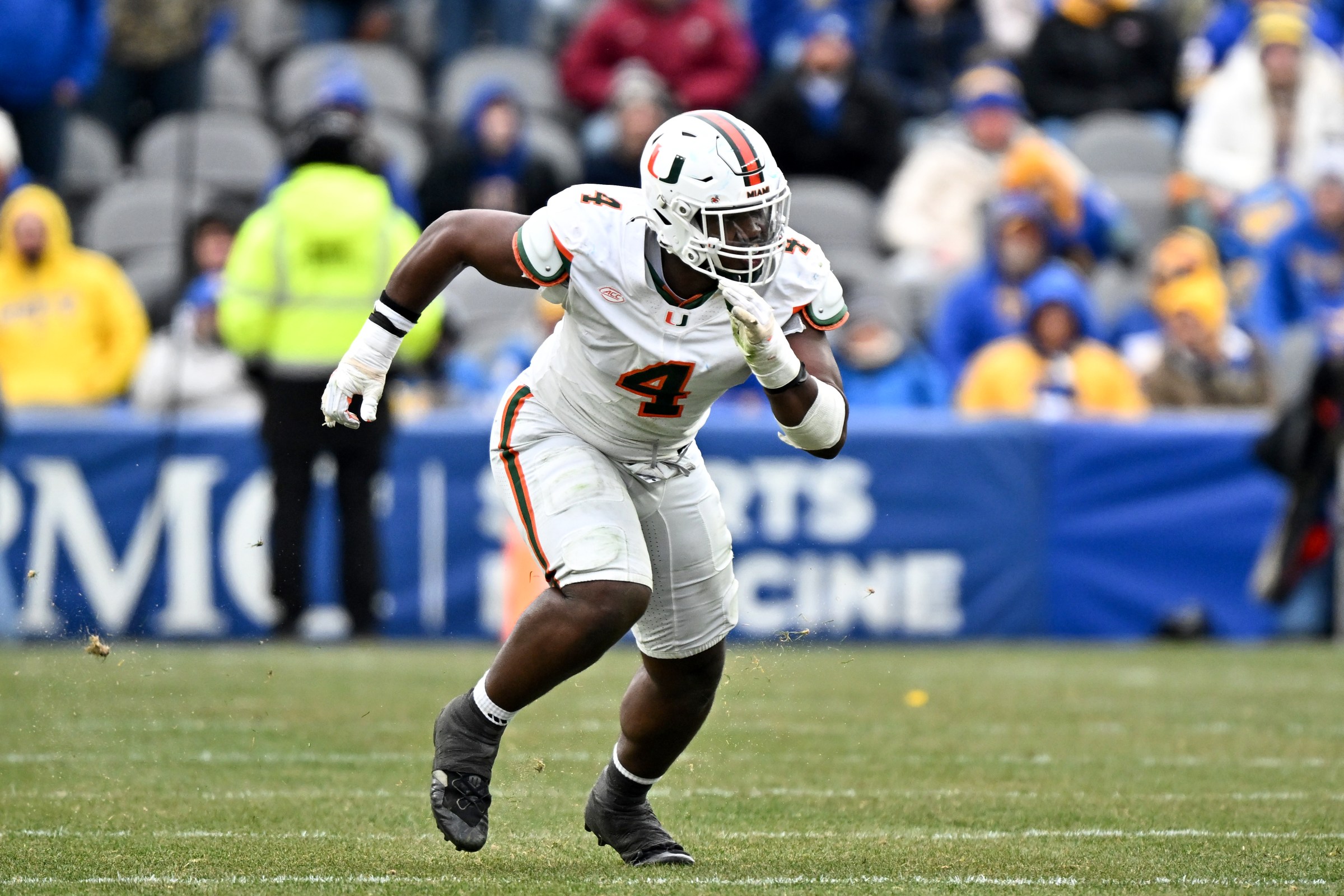 PITTSBURGH, PENNSYLVANIA - NOVEMBER 29, 2025: Rueben Bain Jr. #4 of the Miami Hurricanes rushes the line of scrimmage during the first half against the Pittsburgh Panthers at Acrisure Stadium on November 29, 2025 in Pittsburgh, Pennsylvania. (Photo by Chris Bernacchi/Diamond Images via Getty Images)