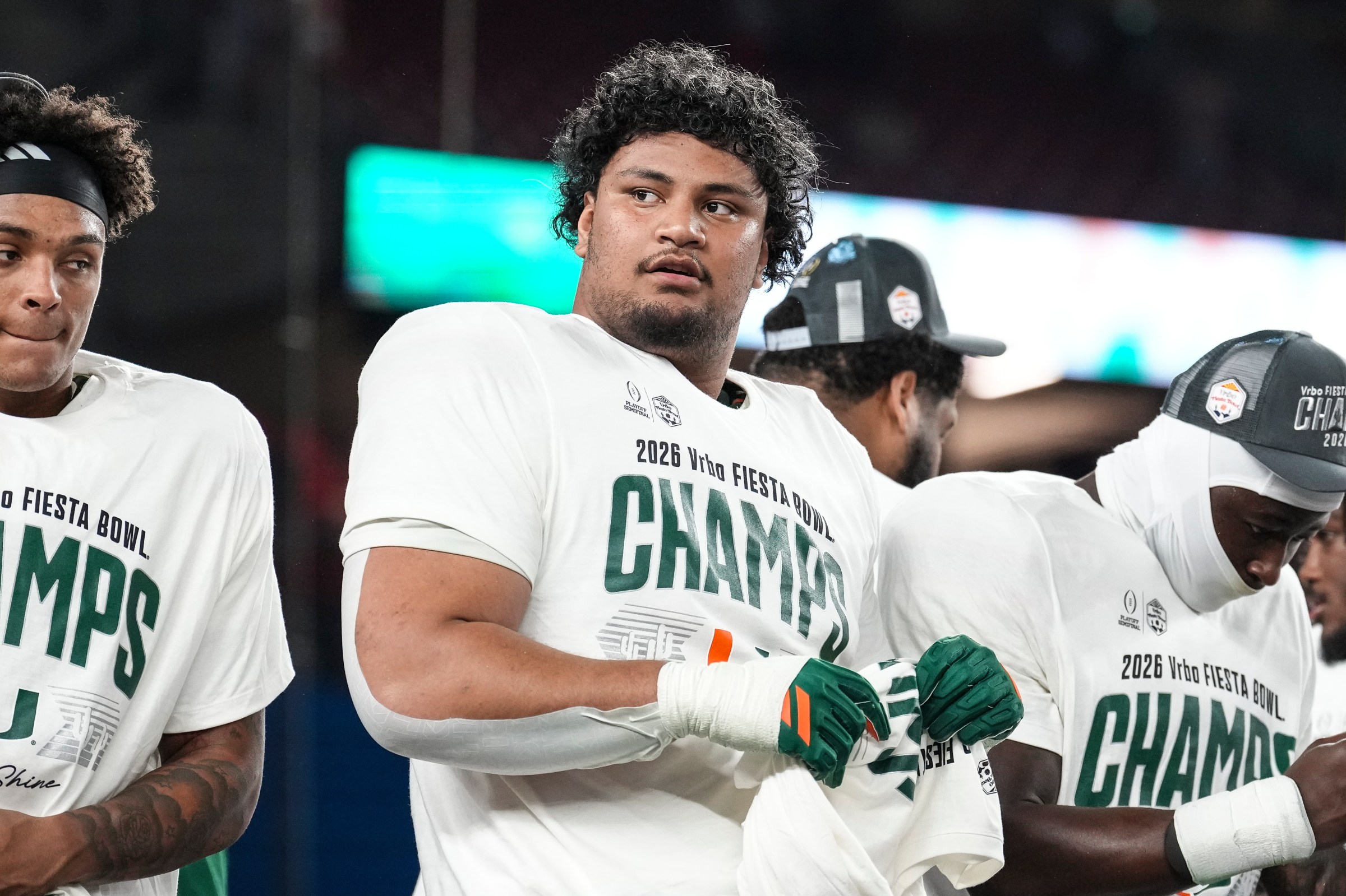 GLENDALE, ARIZONA - JANUARY 8: Francis Mauigoa #61 of the Miami Hurricanes celebrate on stage after the second half of CFP Semifinal Vrbo Fiesta Bowl against the Ole Miss Rebels at State Farm Stadium on January 8, 2026 in Glendale, Arizona.The Miami Hurricanes defeated the Ole Miss Rebels 31-27. (Photo by CFP/Getty Images)
