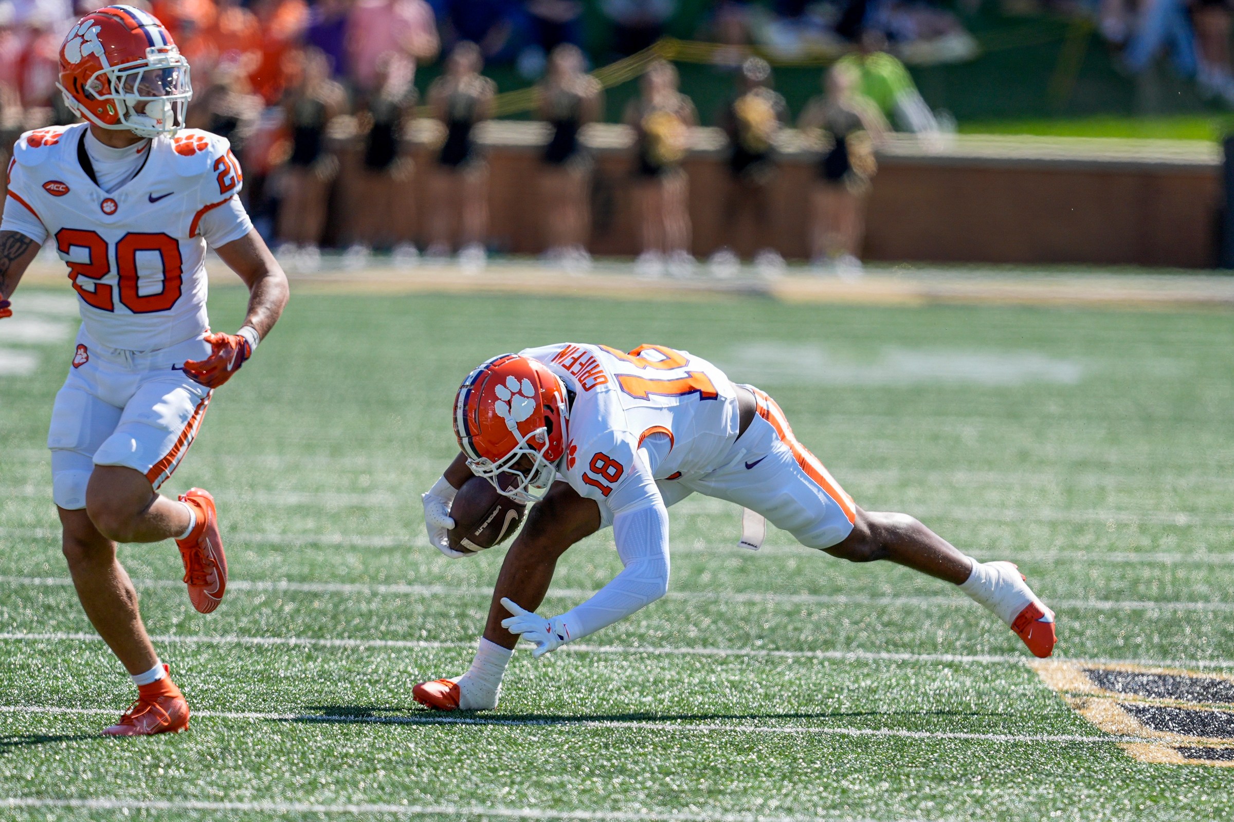 Oct 12, 2024; Winston-Salem, North Carolina, USA; Clemson Tigers defensive tackle DeMonte Capehart (19) trips up on the run after an interception with Clemson Tigers cornerback Avieon Terrell (20) during the first half against the Wake Forest Demon Deacons at Allegacy Federal Credit Union Stadium. Mandatory Credit: Jim Dedmon-Imagn Images