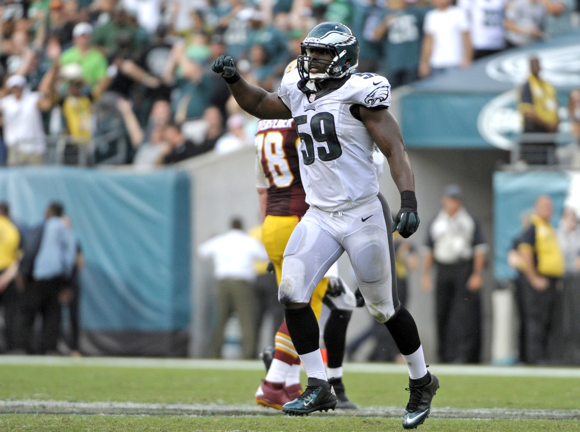 Sep 21, 2014; Philadelphia, PA, USA; Philadelphia Eagles inside linebacker DeMeco Ryans (59) celebrates a defensive stop on third down against the Washington Redskins at Lincoln Financial Field. The Eagles defeated the Redskins, 37-34. Mandatory Credit: Eric Hartline-Imagn Images
