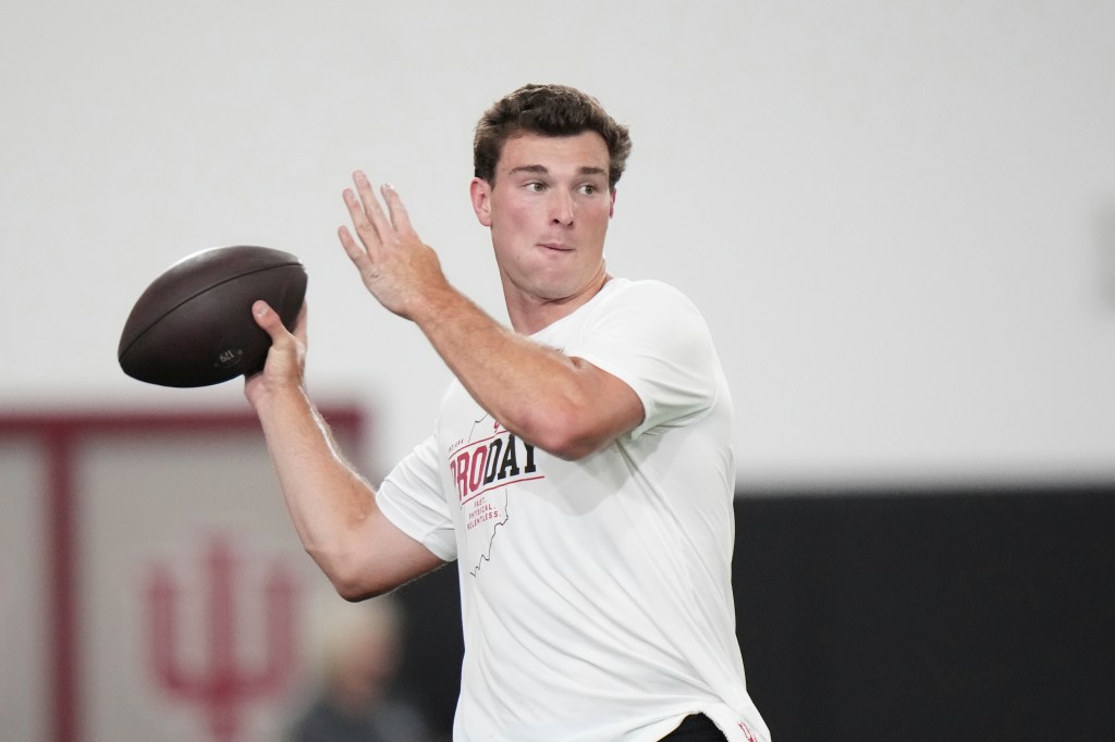 Indiana quarterback Fernando Mendoza looks to throw a pass during the school's NFL football pro day.
