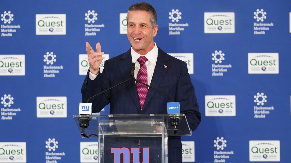 New York Giants head coach John Harbaugh speaking at a press conference