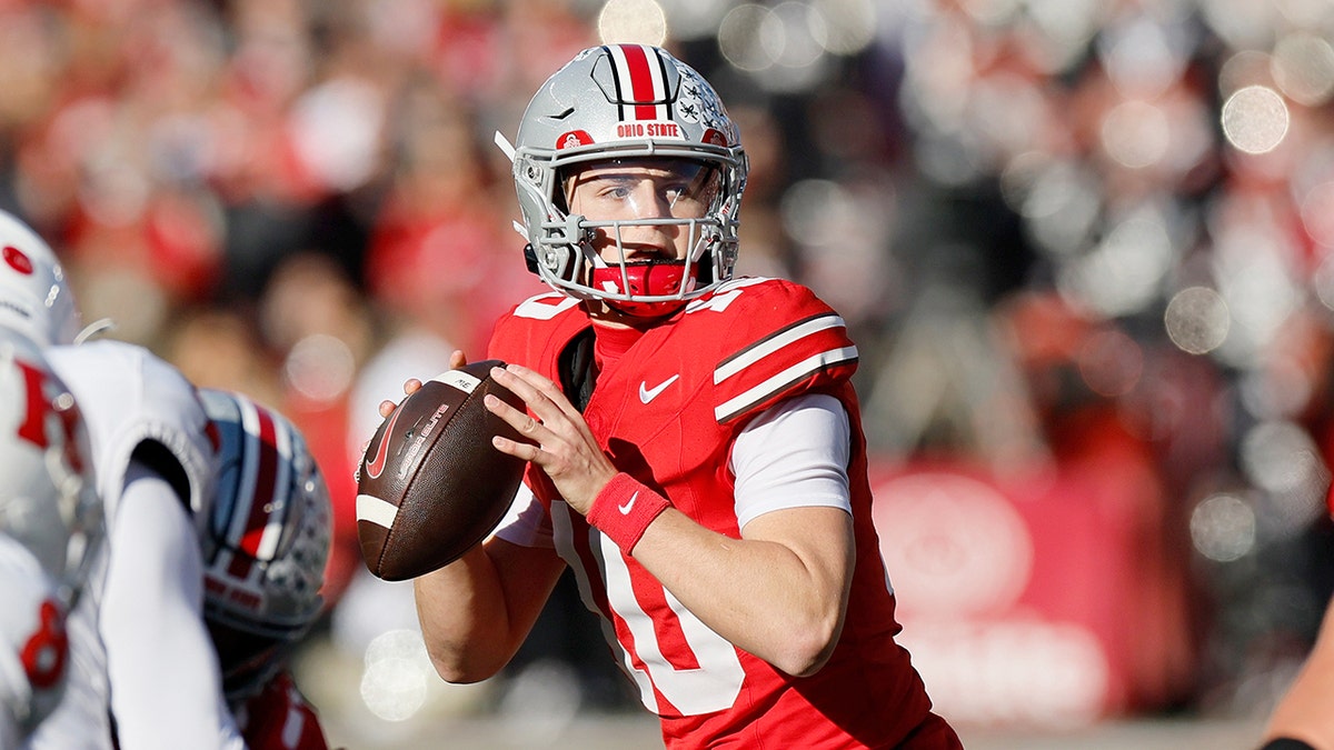 Ohio State quarterback Julian Sayin drops back to pass during a football game