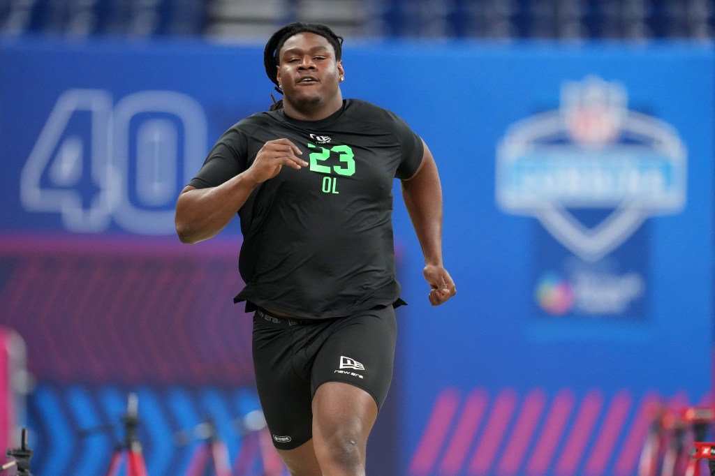 Kentucky offensive lineman Jalen Farmer (OL23) runs a drill at the NFL Scouting Combine.