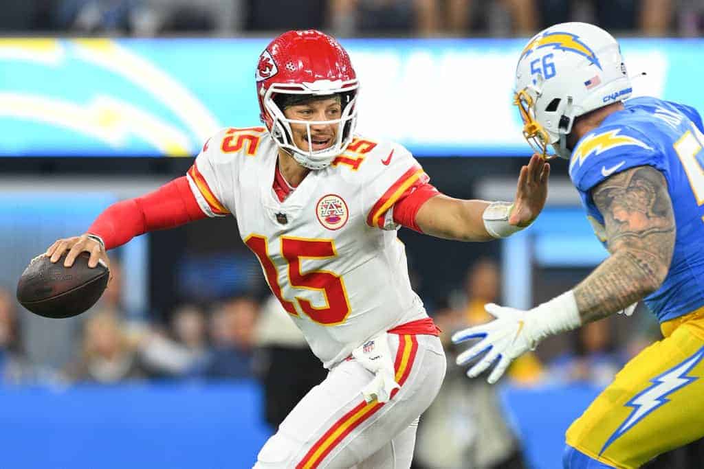 Patrick Mahomes avoids a Chargers defender as he scrambles from the pocket