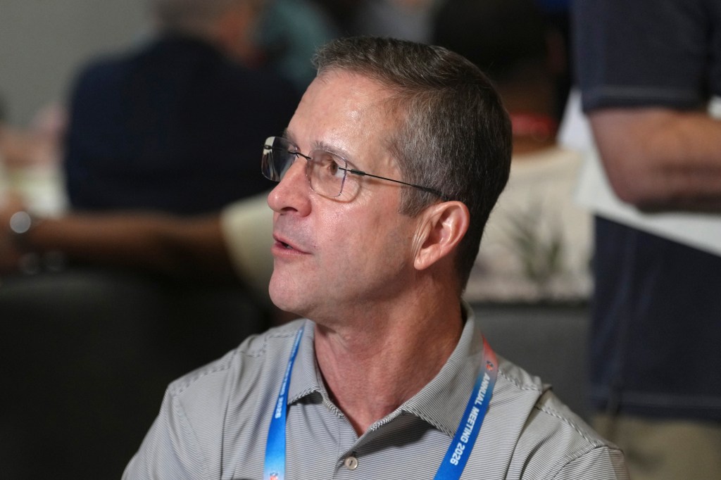 John Harbaugh, head coach of the New York Giants, speaks at the annual NFL football meetings.
