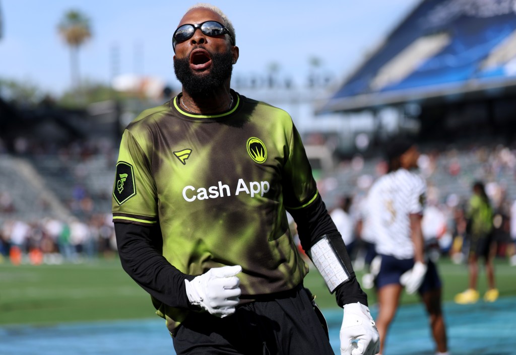 Odell Beckham Jr. in a green and black jersey celebrates a touchdown during the Fanatics Flag Football Classic.