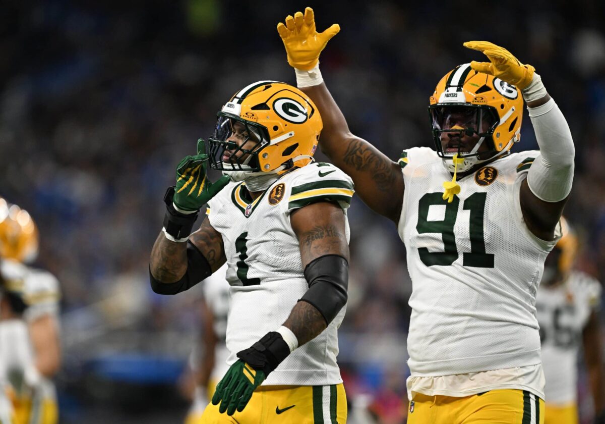 Nov 27, 2025; Detroit, Michigan, USA; Green Bay Packers defensive end Micah Parsons (1) and Green Bay Packers defensive tackle Warren Brinson (91) celebrate after a play against the Detroit Lions during the first quarter at Ford Field. Mandatory Credit: Lon Horwedel-Imagn Images