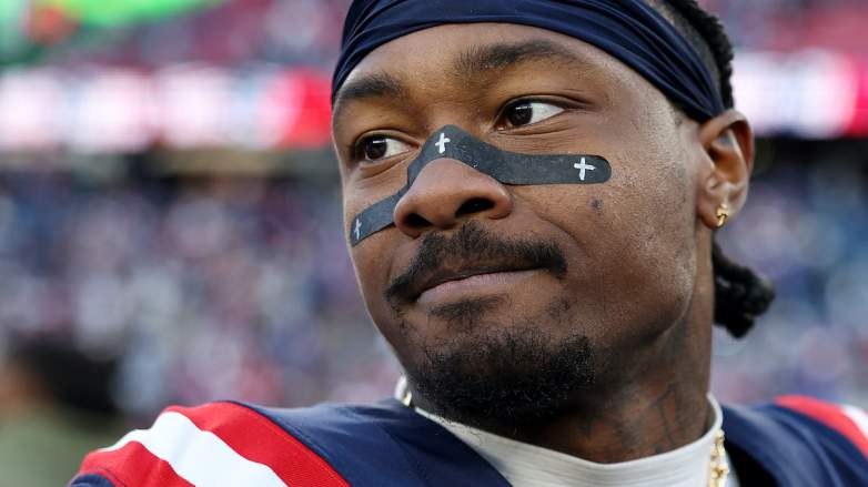 Former Patriots receiver Stefon Diggs looks on from the sideline.