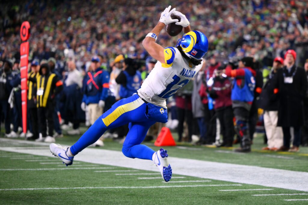 Los Angeles Rams wide receiver Puka Nacua (12) scores a touchdown against the Seattle Seahawks during the second half in the 2026 NFC Championship Game at Lumen Field.