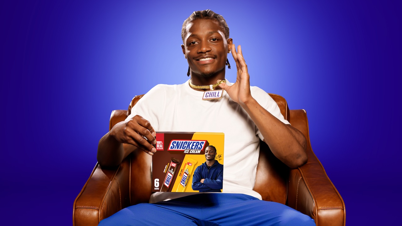 Carnell Tate holds a package of Snickers ice cream